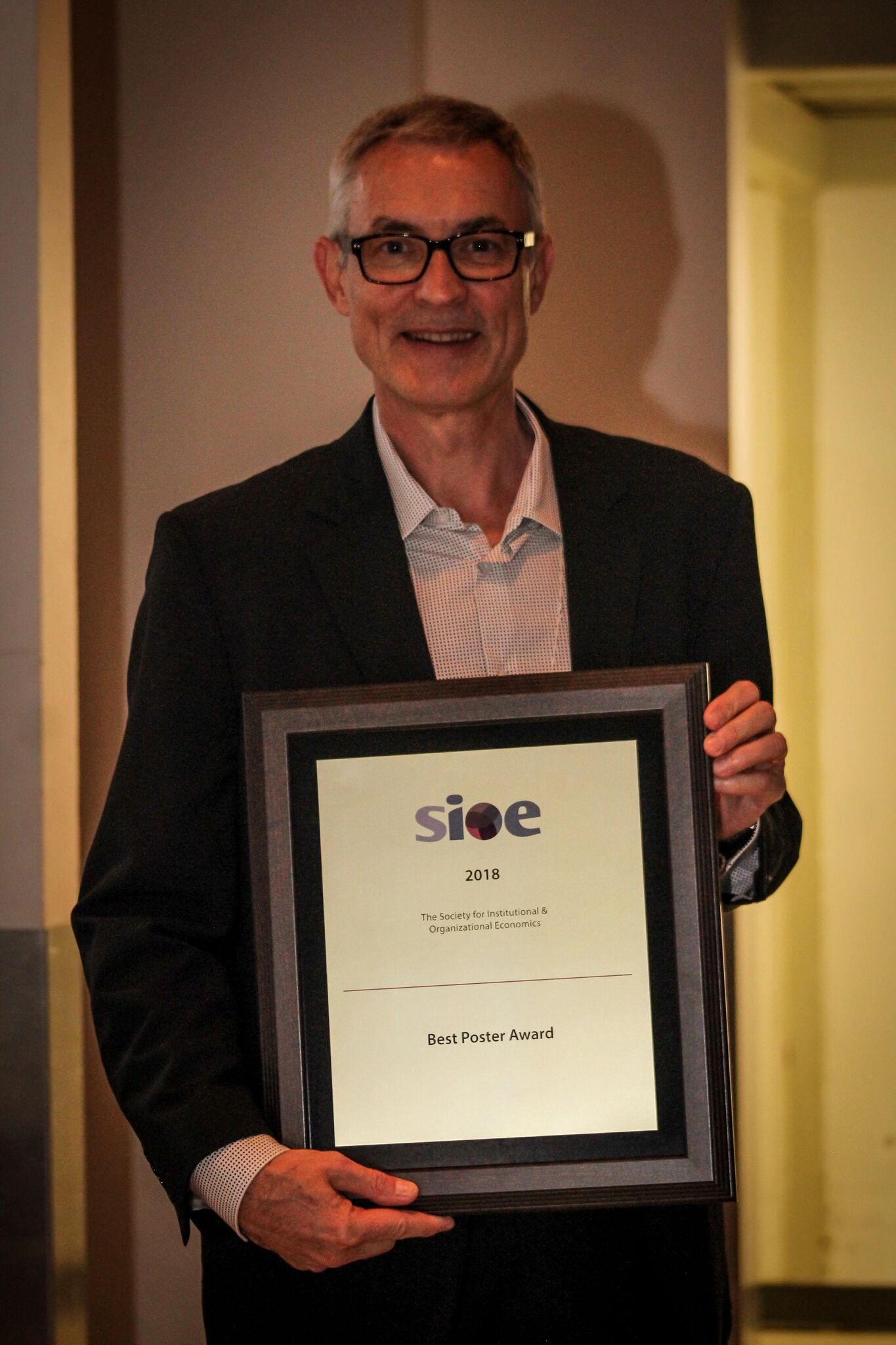 Best Poster Award for Work Comparing Nonprofit and For-profit Firms