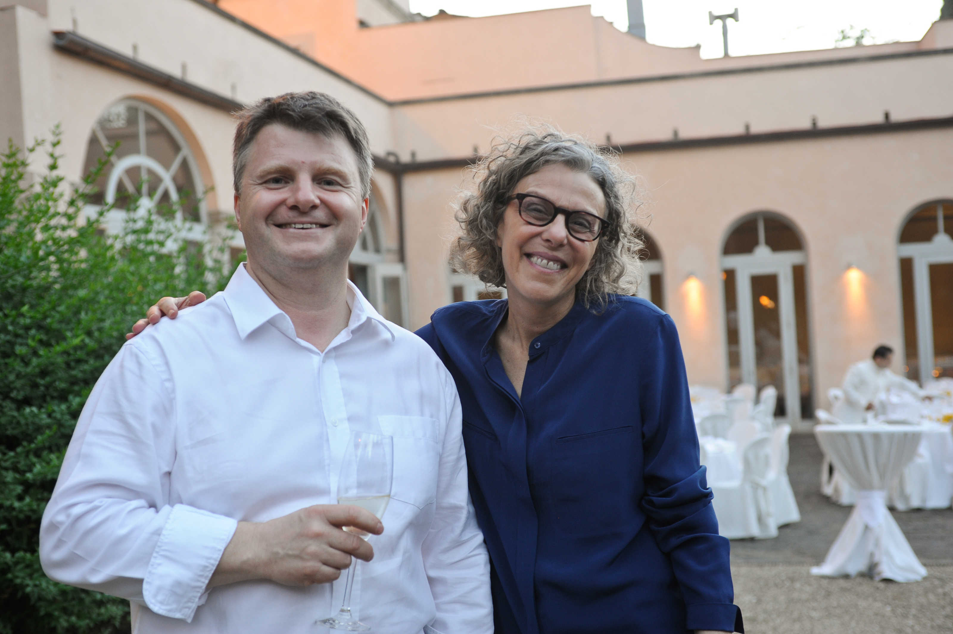 Eric Brousseau (Paris-Dauphine) and Lee Epstein (Washington U) having a good time at a reception in Florence.